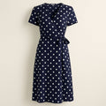 Navy Blue Polka Dot Midi Wrap Dress on a neutral background