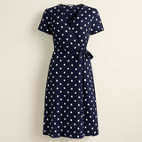 Navy Blue Polka Dot Midi Wrap Dress on a neutral background