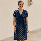 Person using Navy Blue Polka Dot Midi Wrap Dress